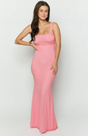 Candy pink maxi formal dress in mesh fabric with back tie detailing styled on brunette model.