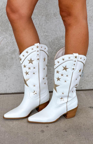 model wearing white pu cowboy boots with gold star details