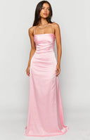 Pink satin maxi formal dress with open tie up back design on dark haired model.