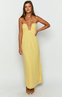 Yellow maxi dress with a cut out on the bust on a brunette model