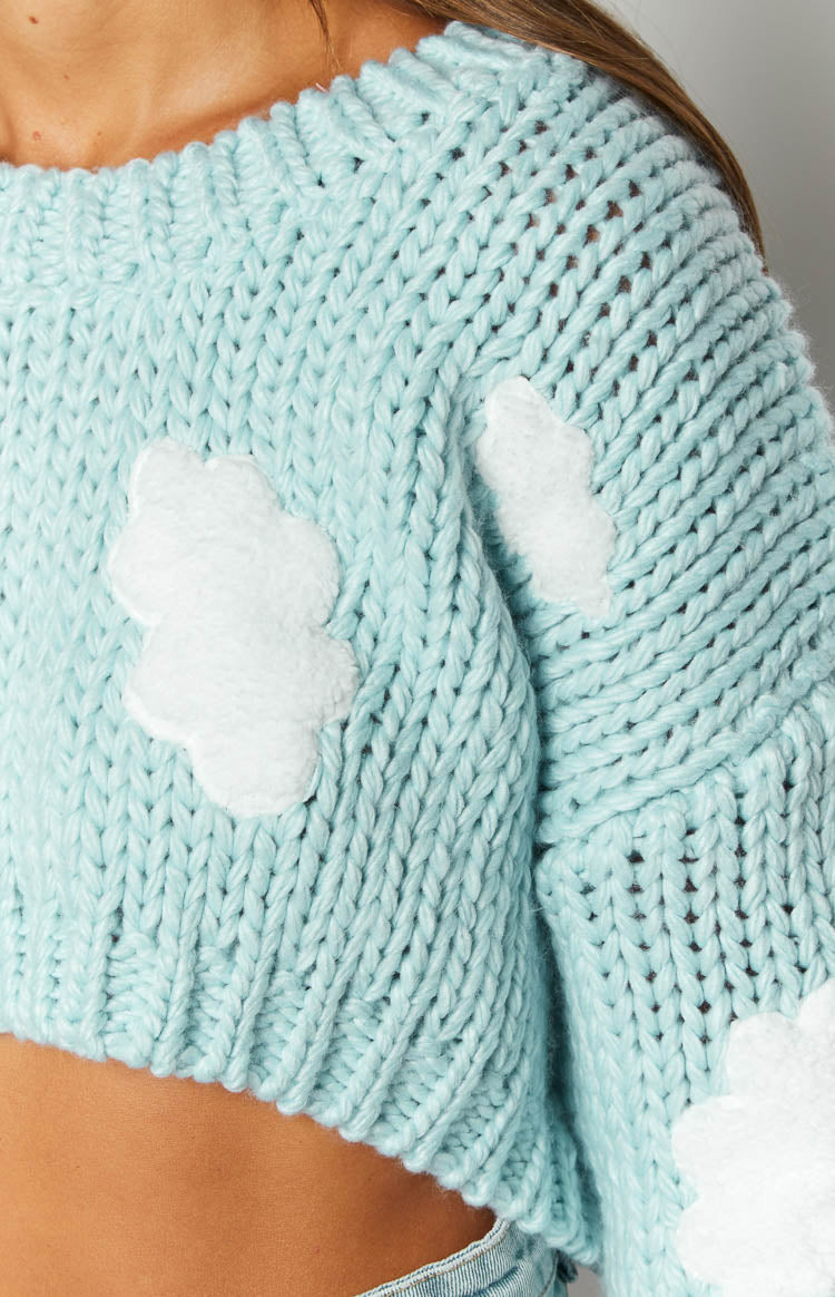 white and blue cloud knit sweater on model