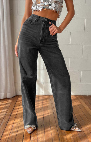 Black straight leg denim jeans on model.