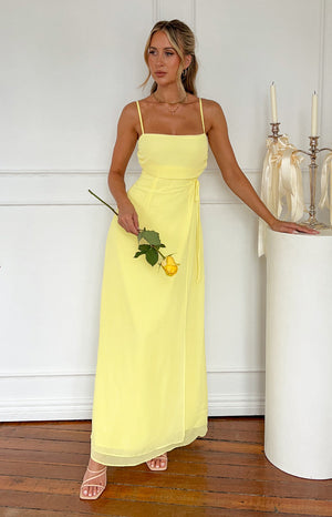 Yellow maxi dress with waist tie on blonde model