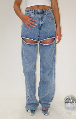 Diamante detailed blue denim jeans with raw hems.