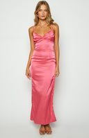 Pink satin formal maxi dress with gathered detailing on bust and thin straps styled on brunette model. 