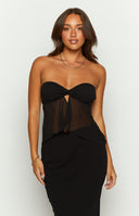 Black strapless top on brunette model