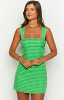 Green tie back mini dress with bow detailings.