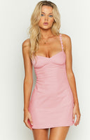 Pink mini dress with flower detailing on straps.