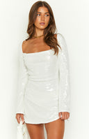 white sequin long sleeve party mini dress on brunette model