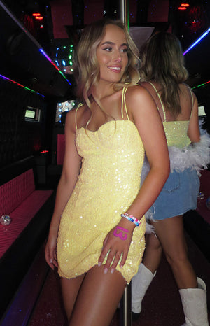 Yellow sequin mini dress.