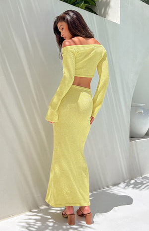 Yellow knit maxi skirt on a brunette model