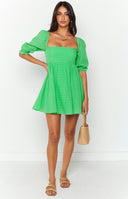 Green mini dress on blonde model