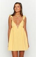 lemon yellow loose fit mini dress with deep v neckline and thin ruffle straps