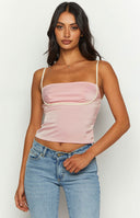 Satin style pink top with white detailing around bust.